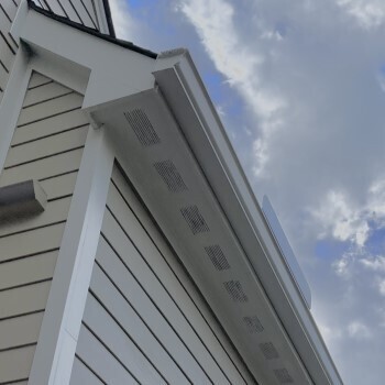 View from below looking up at soffits installed on a house